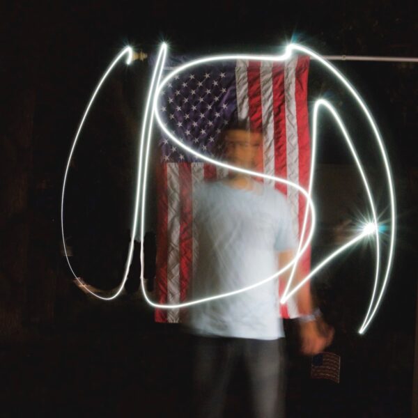 man-standing-with-light-painting-and-american-flag-2026-09-23-23-17-44-utc copy 2